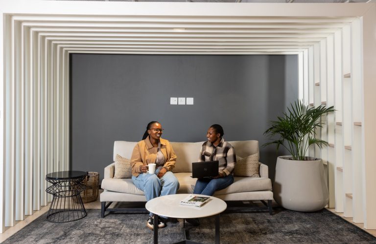 Two colleagues in the breakout area at TBE Bridgeway, Century City